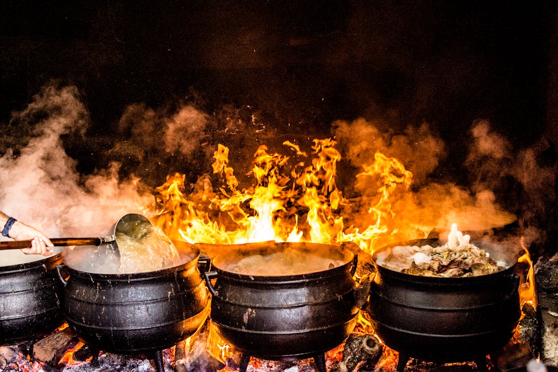 Free Time Lapse Photography of Four Black Metal Cooking Wares Stock Photo
