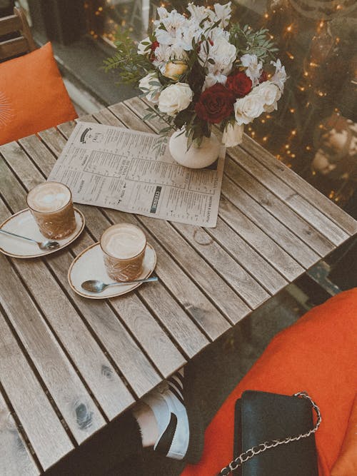 Free Coffee on a Wooden Table Stock Photo