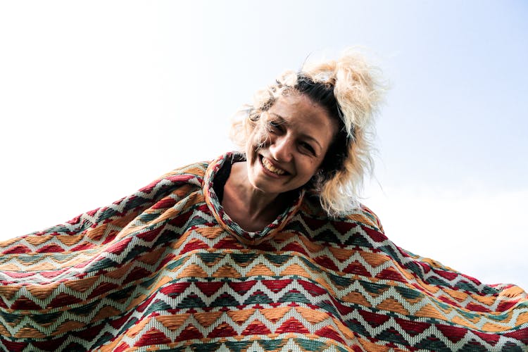 A Woman Wearing A Kitted Shawl