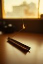 Black Lighter on Brown Wooden Table