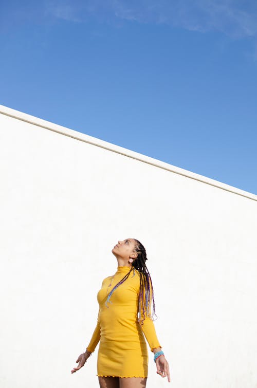 Woman in Yellow Turtle Neck Long Sleeve Dress