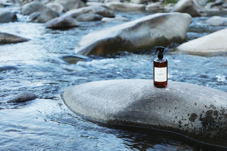 Spray Bottle On Top Of A Rock