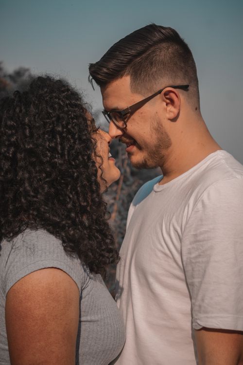 Free Couple in love sharing an intimate moment outdoors in Curitiba, Brazil. Stock Photo