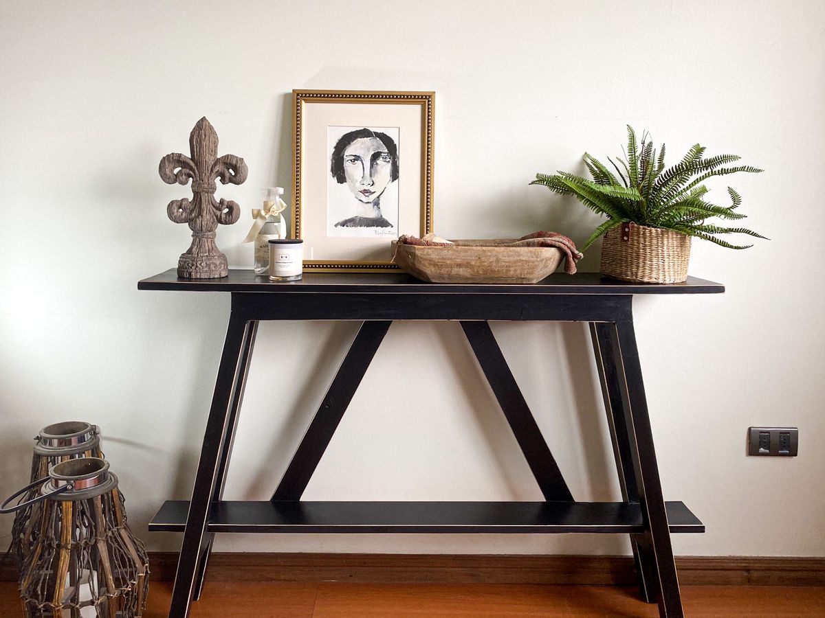 Decorative framed art and console table in a home interior