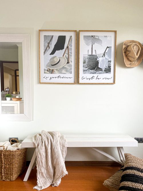 Free Minimalist interior design featuring a bench, wall art, and woven textures. Stock Photo