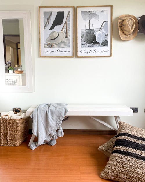 White Bench and Pictures In a House with Wooden Flooring