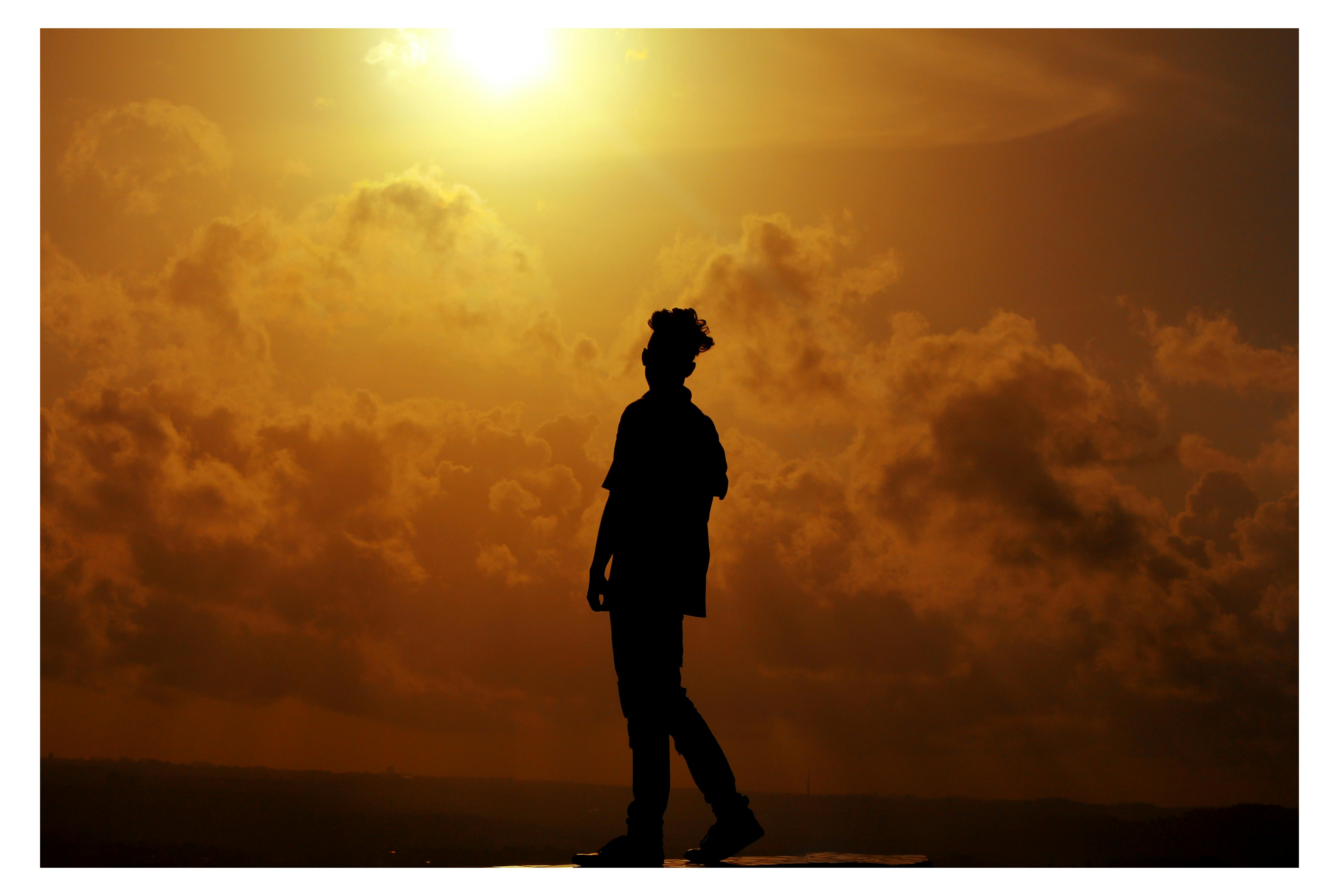 Silhouette of Man During Sunset · Free Stock Photo