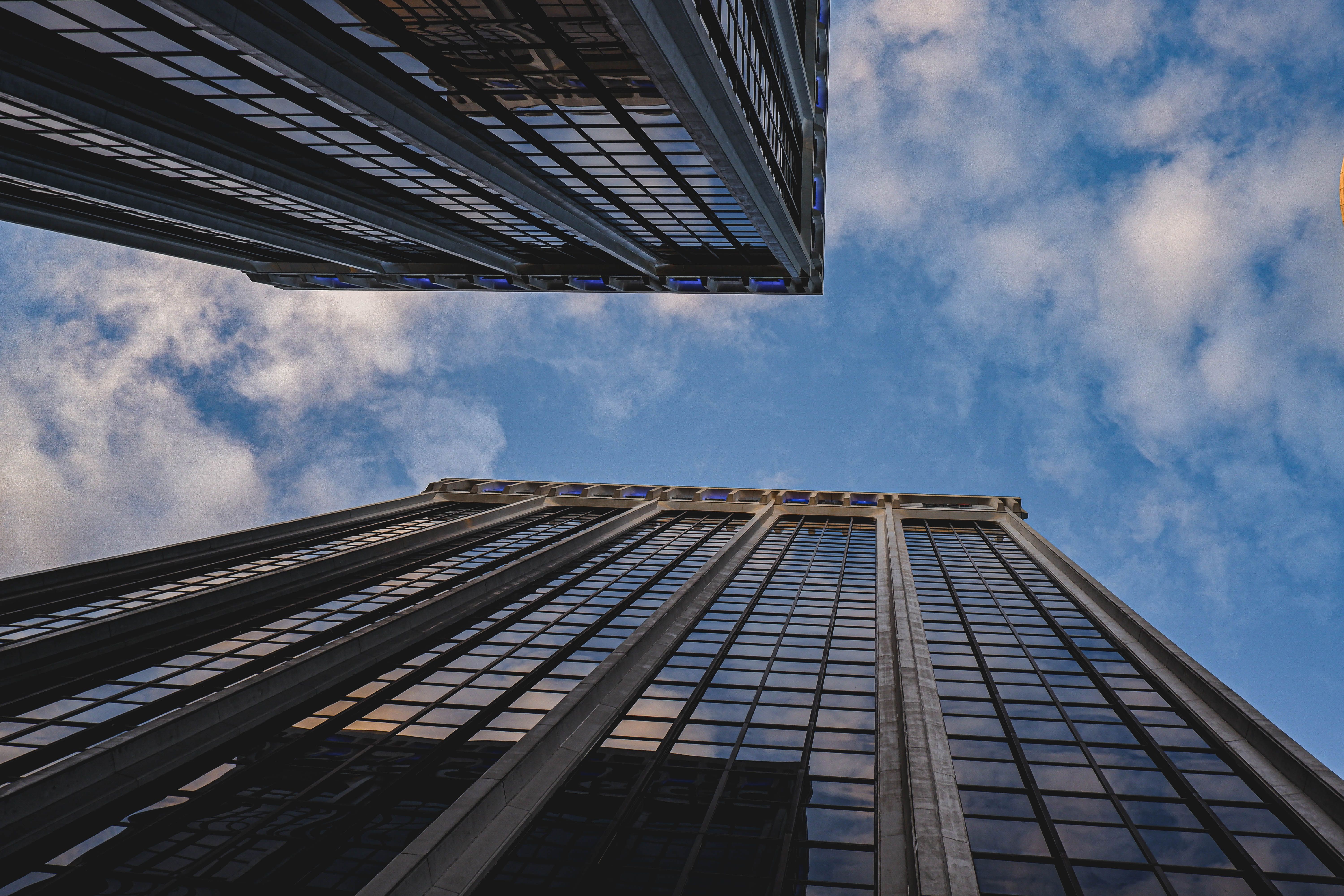 Low Angle Photography of Two Buildings Under Blue Sky with White Clouds ...