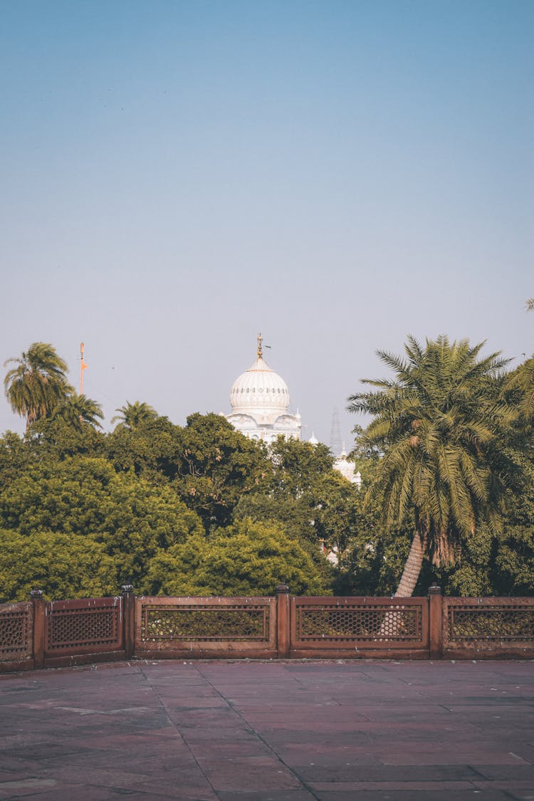 Dome Of Samadhi Of Ranjit Singh Over The Trees Behind The Terrace Railing, Lahore, Pakistan