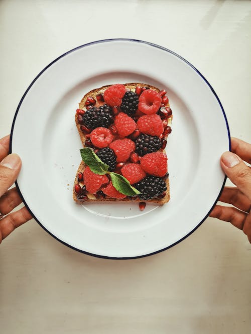 Free Top View of a Bread in a Plate with Berries Stock Photo