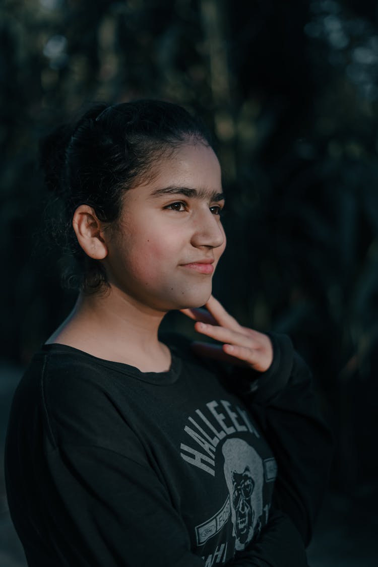  Young Girl Smiling And Holding Her Jaw