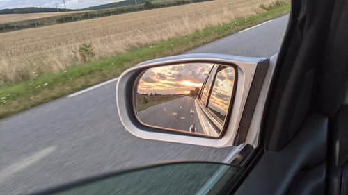 Kostenloses Stock Foto zu mercedes benz, rückspiegel, sonnenuntergang