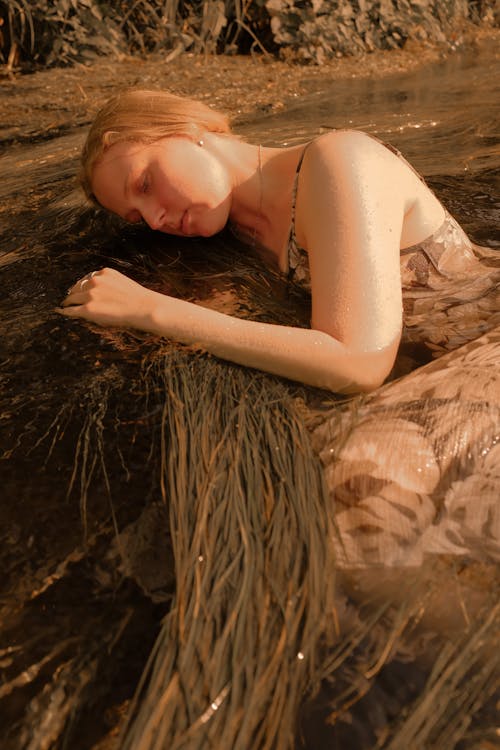 Woman Lying Down on a Creek