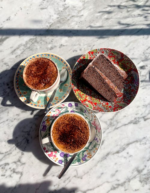 Free Slice of Chocolate Cake Beside Two Cups Of Turkish Coffee Stock Photo