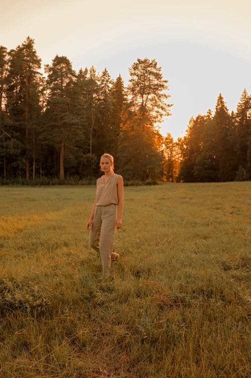 Pretty Woman Walking on Grass