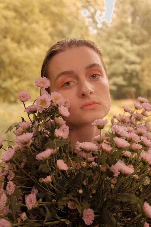 Free Beautiful Woman Holding Flowers Stock Photo