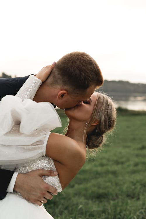 Free A Bride and Groom Kissing Stock Photo