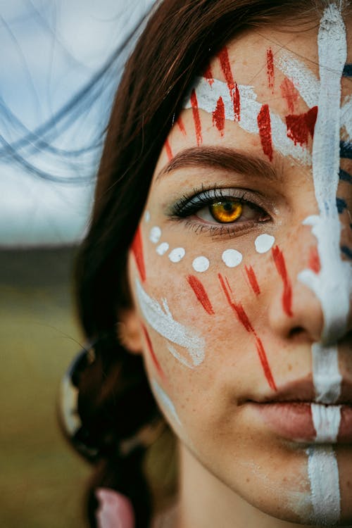 Woman With Red and White Face Paint
