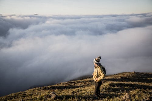 Free Man Standing on Top of Moutain Stock Photo