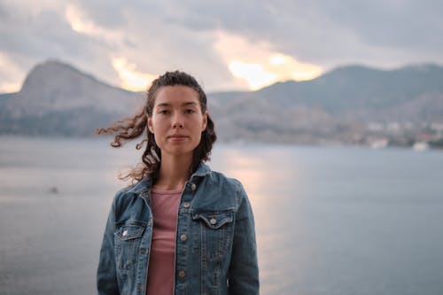 Shallow Focus of a Woman in Blue Denim Jacket