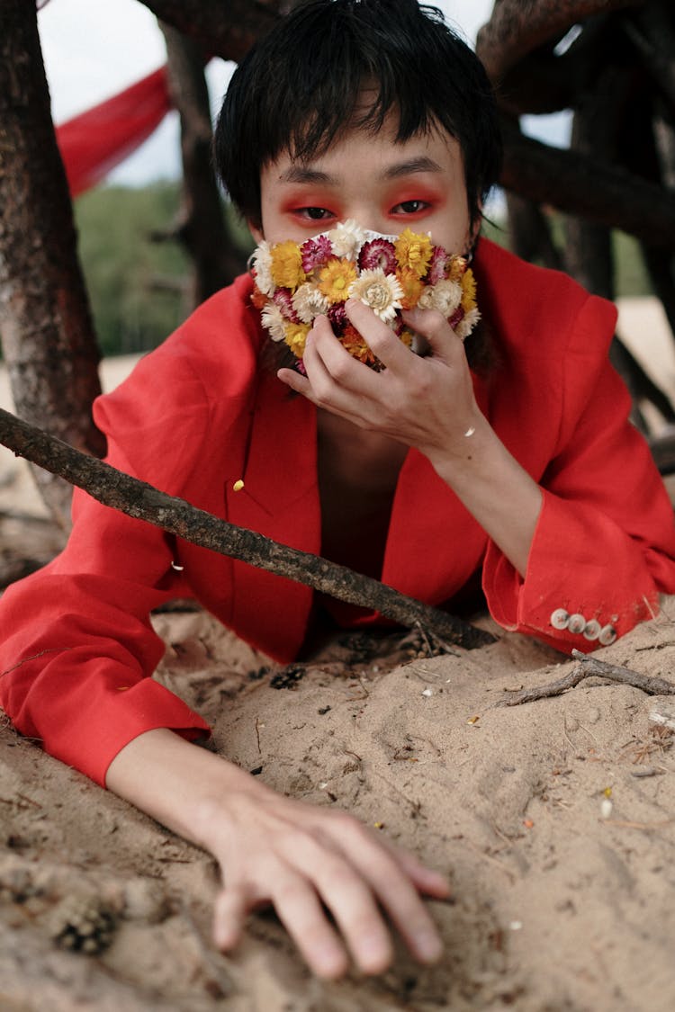 A Woman Wearing A Floral Facemask