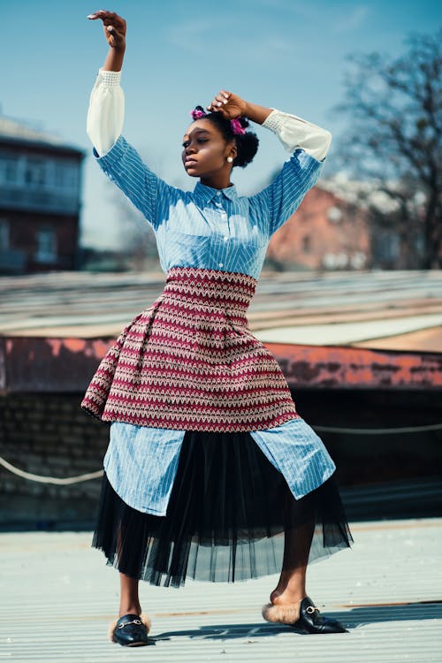 Woman Wearing Blue and Maroon Dress