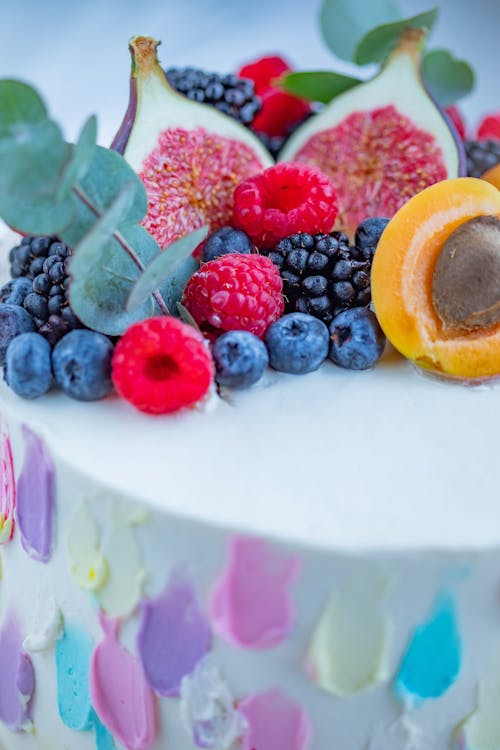 Free Fruits and Colorful Icing on a Cake  Stock Photo