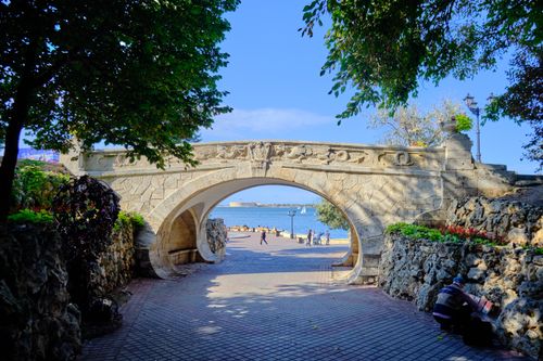 Free Discover the iconic Lovers Bridge in Sevastopol with a picturesque view of the Black Sea. Stock Photo