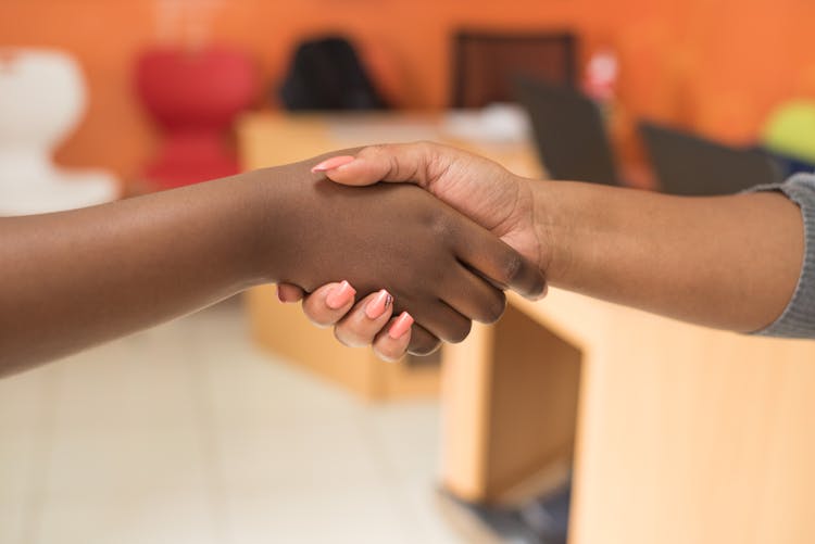 Two People Shaking Hands