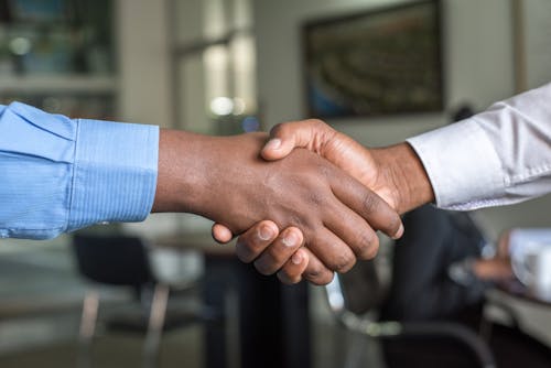 Free Two Person in Long-sleeved Shirt Shakehand Stock Photo