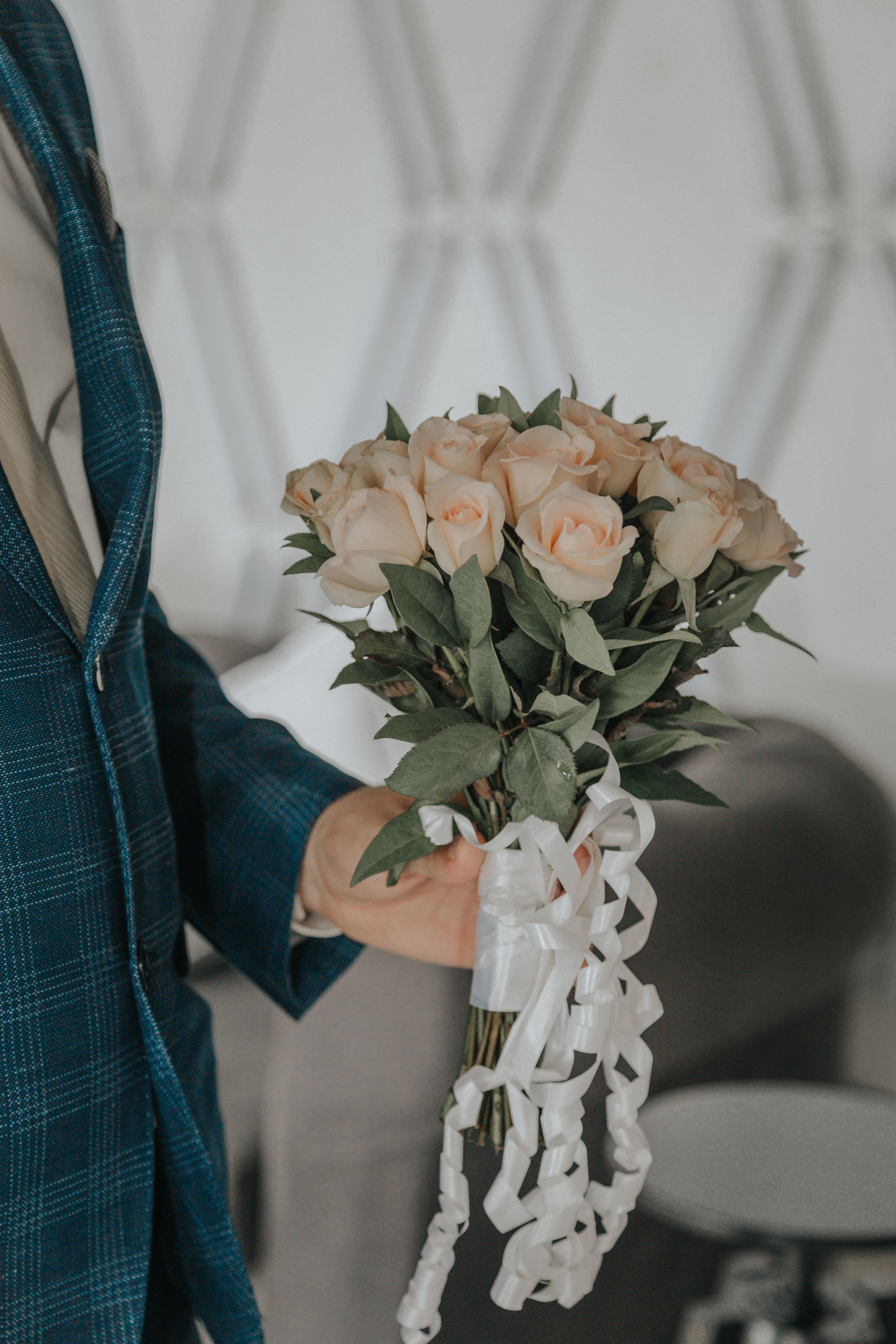 Black and White Photo of Woman Holding Bouquet of Roses · Free Stock Photo