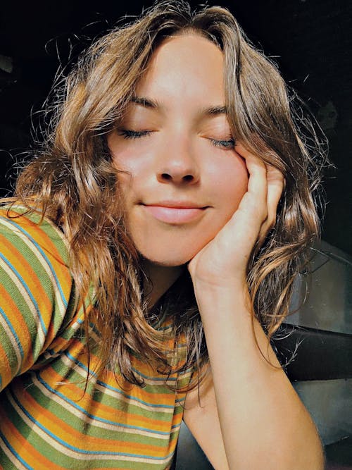 A Woman Wearing a Striped Shirt 