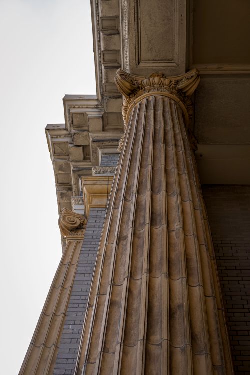 Free Low angle view of a grand stone column showcasing classical architecture. Stock Photo