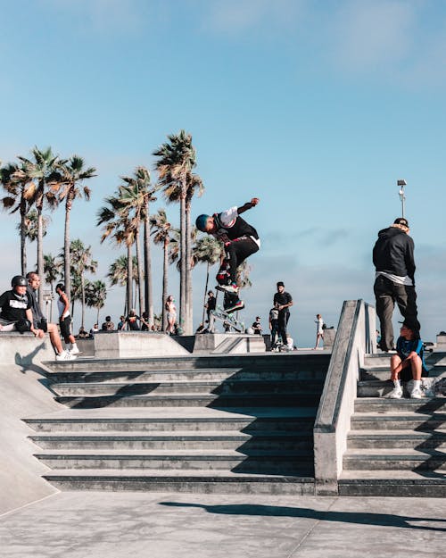 Free Skateboarder Doing Tricks on Stairs Stock Photo