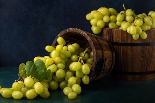 Free  Green Grapes on Brown Wooden Basket Stock Photo