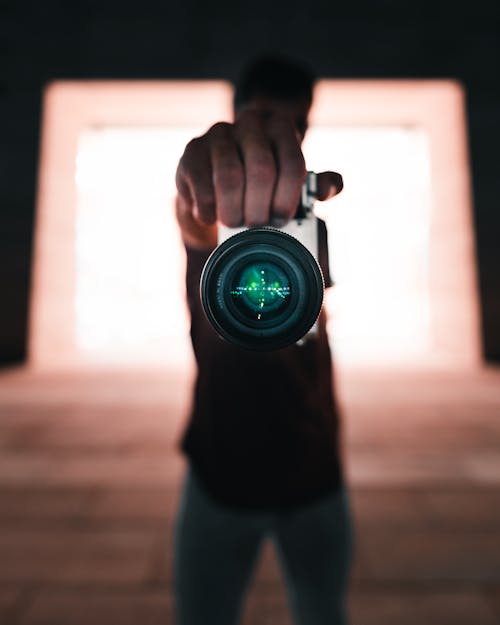 Free A Person Holding a Camera  Stock Photo