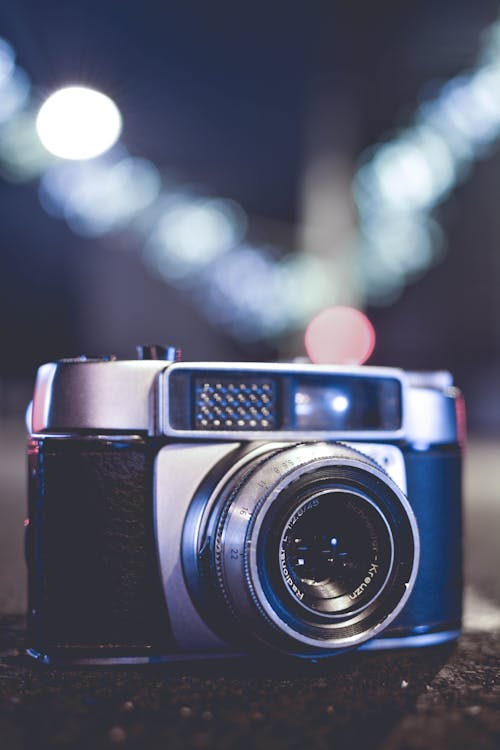 Selective Focus Photo of Gray and Black Slr Camera