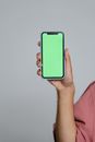 Person Holding Iphone With Teal Case