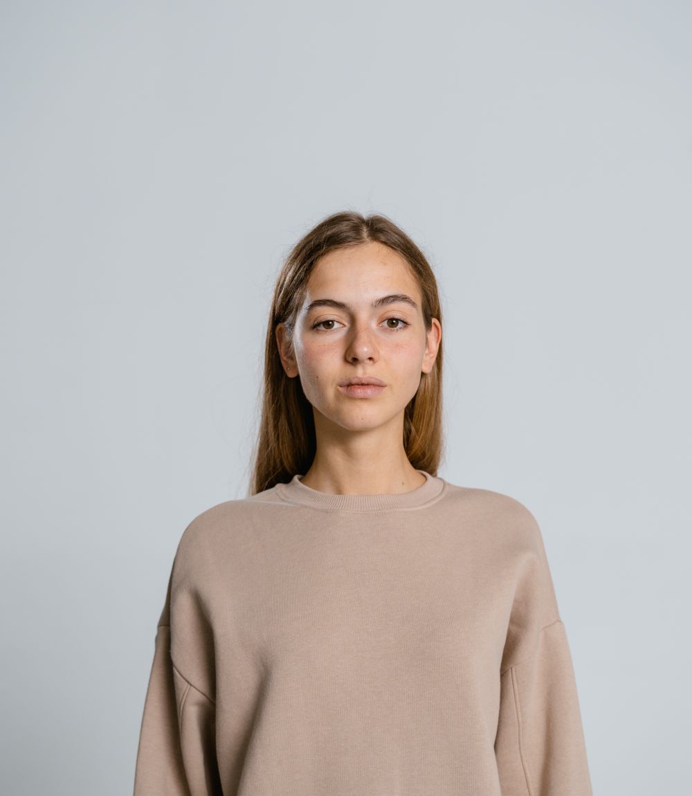 Model wearing a heavyweight brown long sleeve top