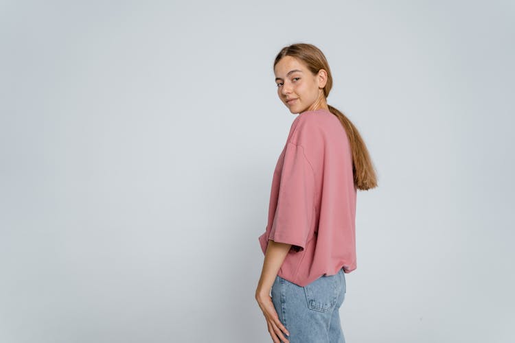 Girl In Pink Long Sleeve Shirt And Blue Denim Jeans