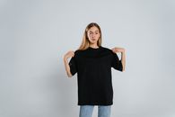 Woman in Black Crew Neck T-shirt and Blue Denim Jeans