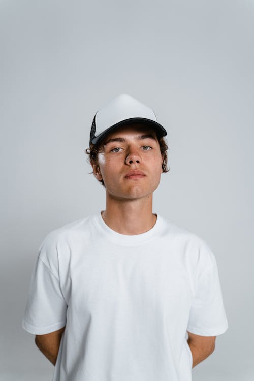 Free Man in White Crew Neck Shirt Wearing Black Headphones Stock Photo