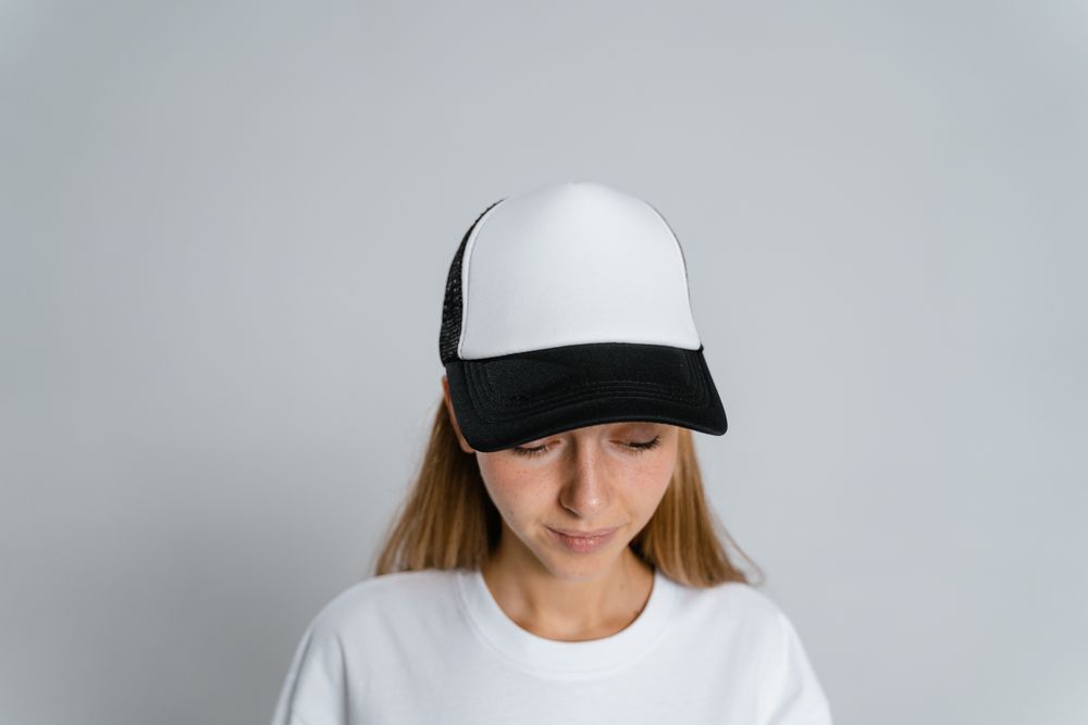 Court cap worn on a studio backdrop — photo by MART PRODUCTION on Pexels