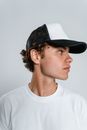 Man in White Crew Neck Shirt Wearing Black Fedora Hat