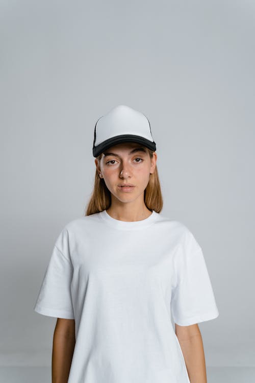 Free Woman in White Crew Neck Shirt Wearing White Cap Stock Photo