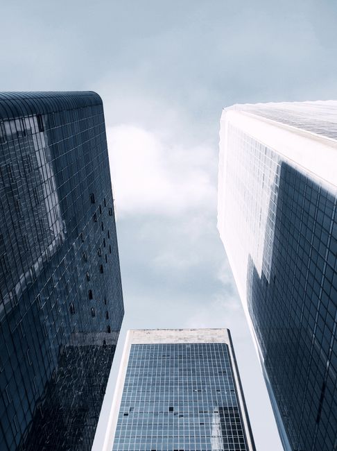 Low angle view of modern skyscrapers in São Paulo, showcasing architecture and city life.