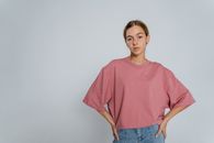 Woman in Red Crew Neck T-shirt and Blue Denim Jeans