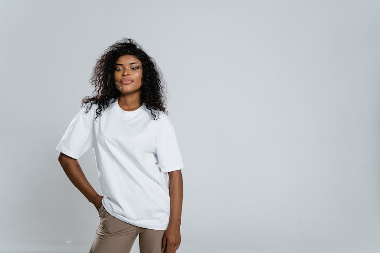 Woman In White Crew Neck T-shirt And Brown Shorts