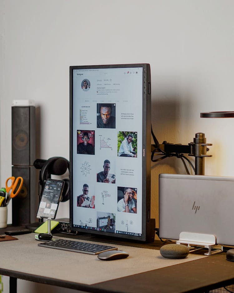 A  Computer Screen With A Man's Profile On A Desk