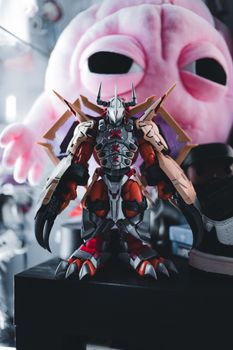 A detailed close-up shot of a Digimon toy, highlighting its intricate design.